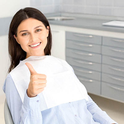 Thumbs up after undergoing advanced dental implant procedures in Phillipsburg