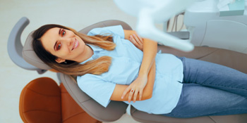 Woman smiling while sitting in treatment chair