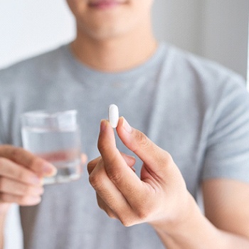 dental patient taking pill for oral conscious sedation