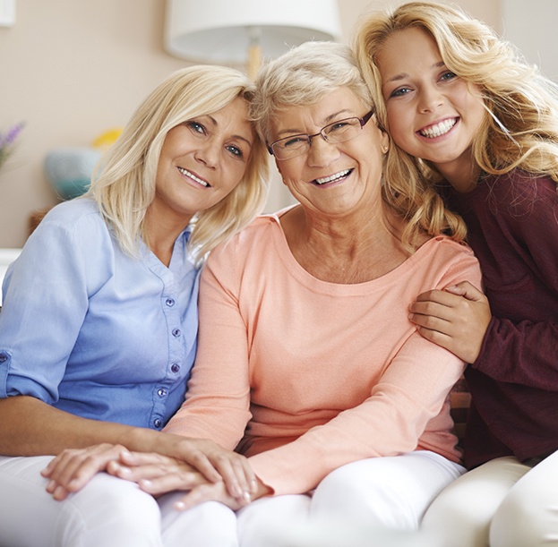 Mother grandmother and daughter smiling together