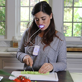 Woman using Glo system as she cooks