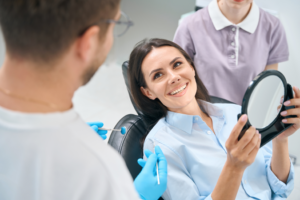 a patient smiling at her dentist