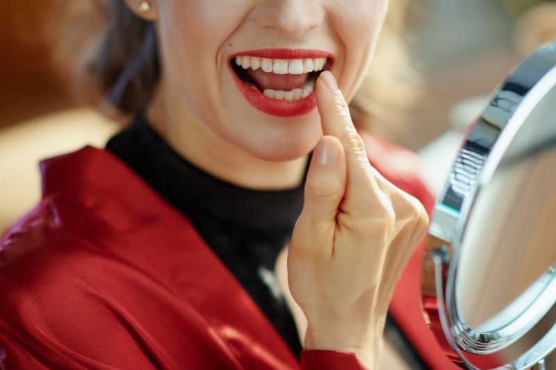 Patient smiling after cosmetic dentistry